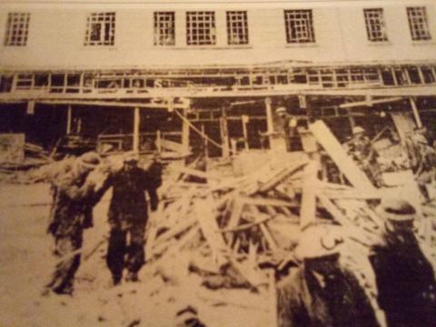 CREDIT: Lowestoft War Memorial Museum- Rescue workers search the rubble of what had been Hepworth's outfitters, Trueform, Boots, and Morlings, opposite Hills and Steele (later British Home Stores)